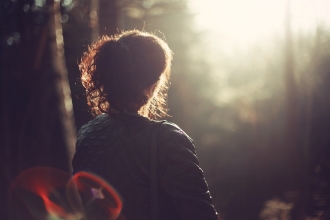 woman looking into the sun