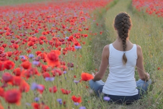 woman in poppy field