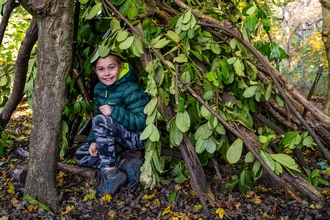 Boy in den by Adrian Clarke