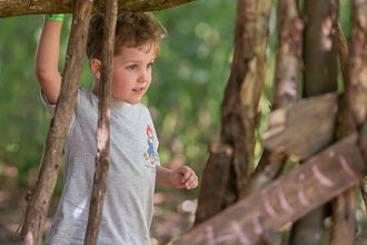 Boy building den Playday 2025 by Susan Freeman