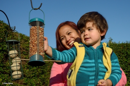 Filling bird feeder