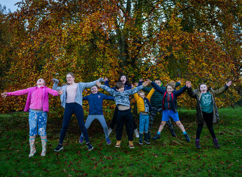 Children jumping by Adrian Clarke 2023